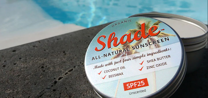 A tin of Shade plastic free sunscreen by a pool