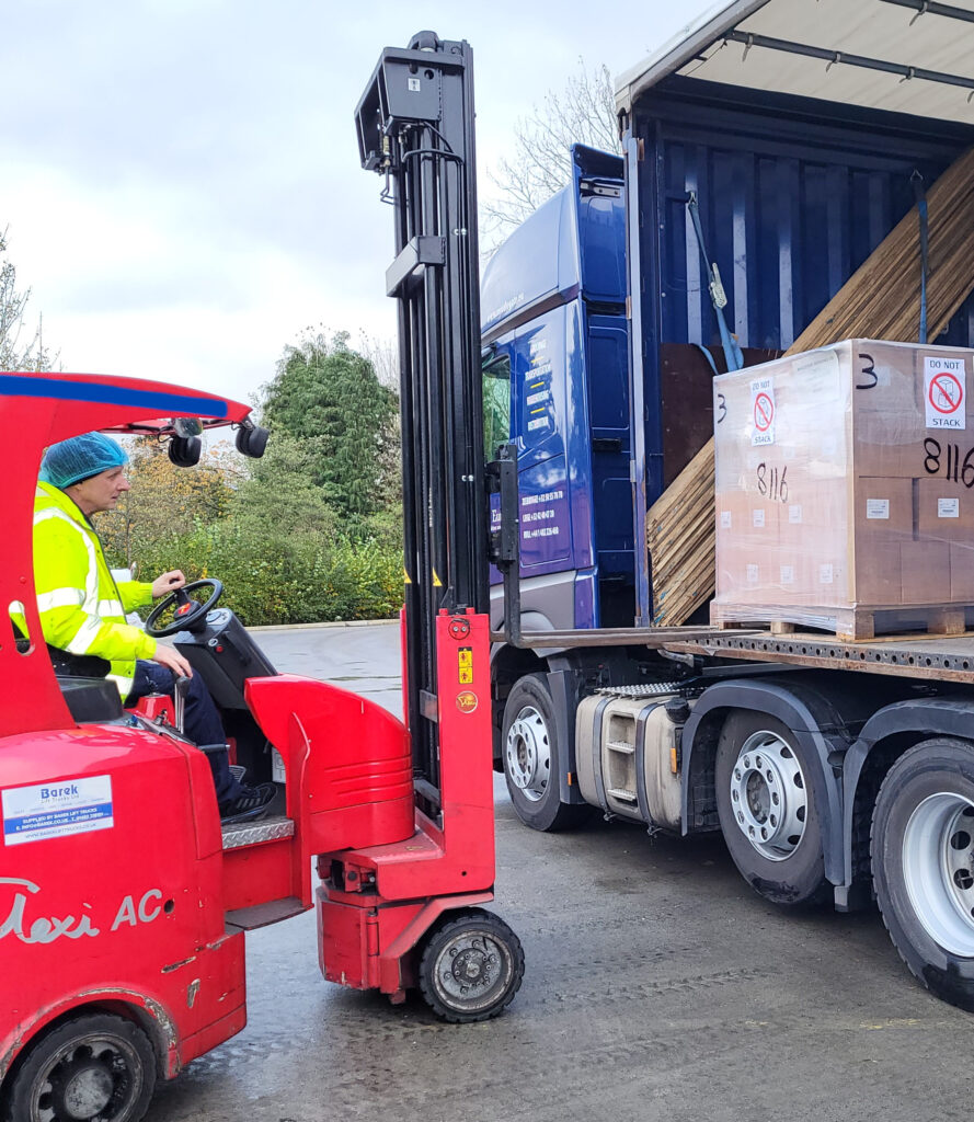 A Bio-D staff member loading their donation onto a lorry.