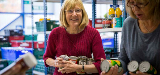 Smiling staff member at the Newcastle West End Foodbank