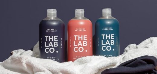 3 bottles of the lab co laundry detergent in a line