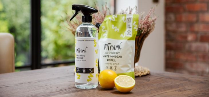 Miniml lemon white vinegar bottle and refill pouch on a bench