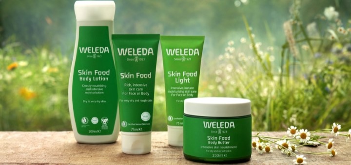 A selection of Weleda Skin Food products on a table outside