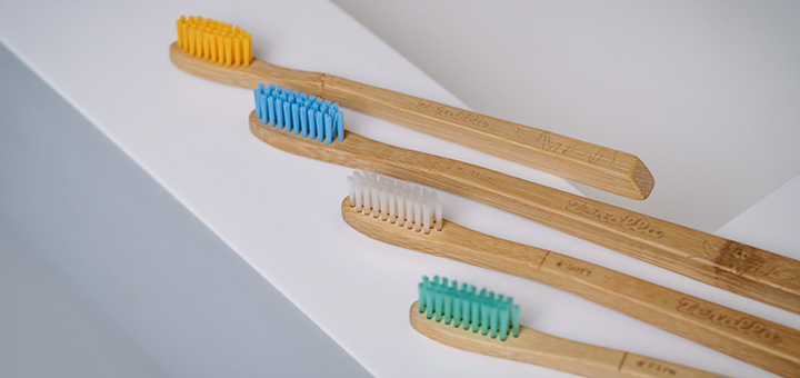 4 zerolla toothbrushes on a sink