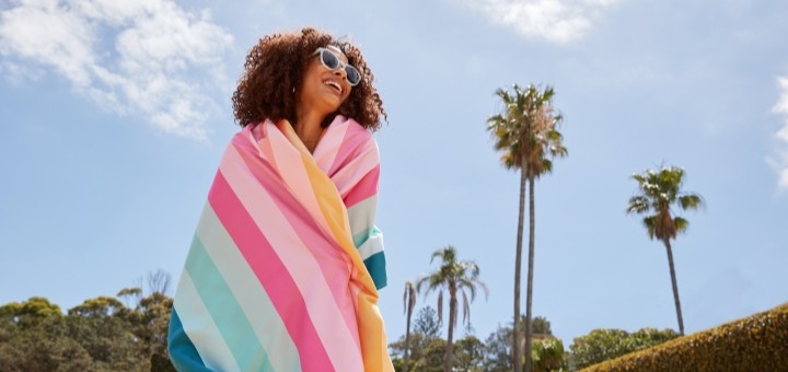 A women wrapped in a Dock and Bay towel